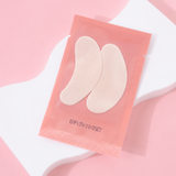 Pack of beige insole pads on a pink background