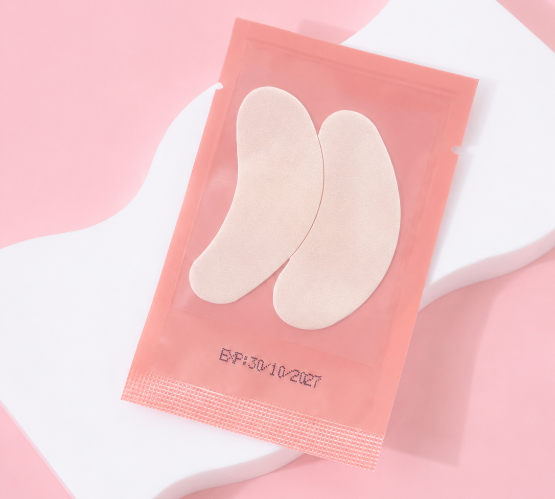 Pack of beige insole pads on a pink background